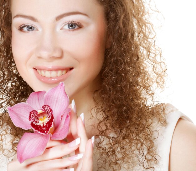 Beautiful woman with pink flower