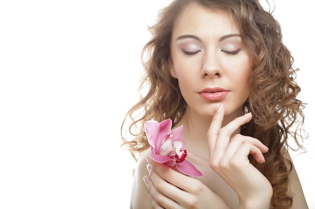 Beautiful woman with pink orchid