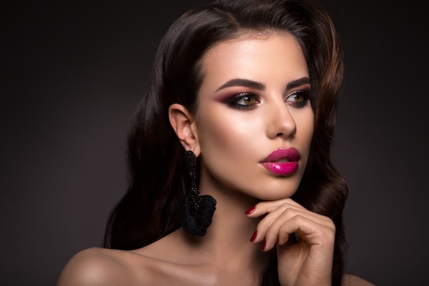 Beautiful woman with professional make up. Pink lips