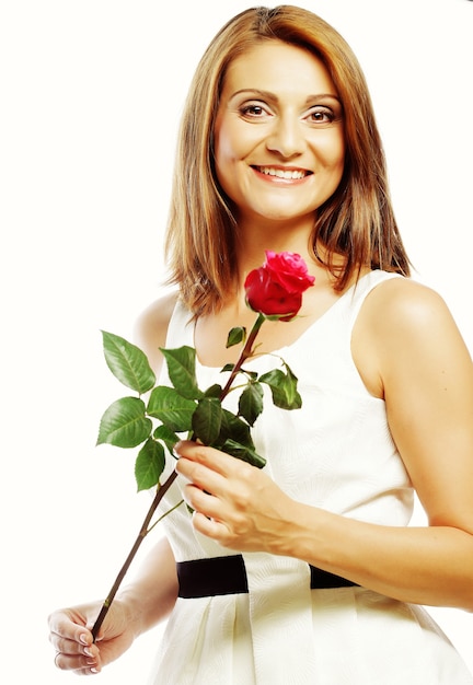 Beautiful woman with red rose isolated on white