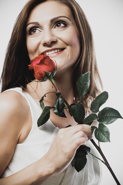 Beautiful woman with red rose