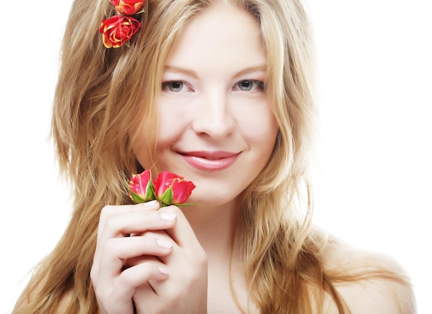 Beautiful woman with roses in hair