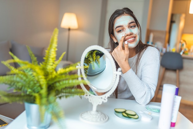 Beautiful woman with spa facial mask.