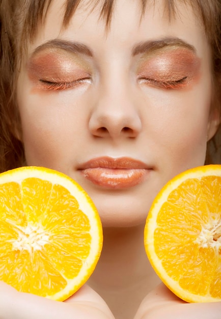 Beautiful womans face with orange