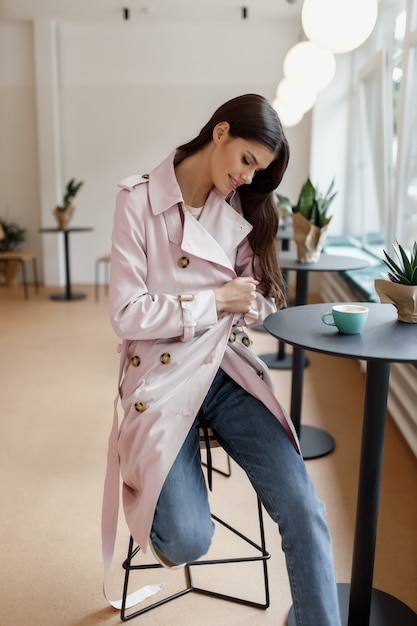 Beautiful women in a coffee shop with a cup of coffee