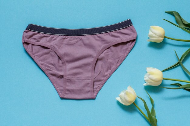 Beautiful women's cotton panties on a blue background