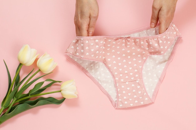 Beautiful women's cotton panties on pink background