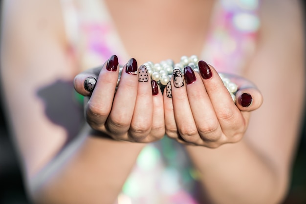 Beautiful women's hands holding pearl