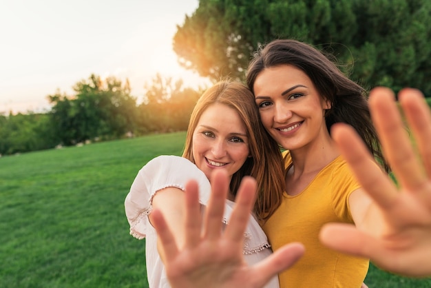 Beautiful women smiling and having fun in the park.