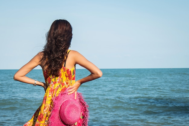 Beautiful women standing on the beach