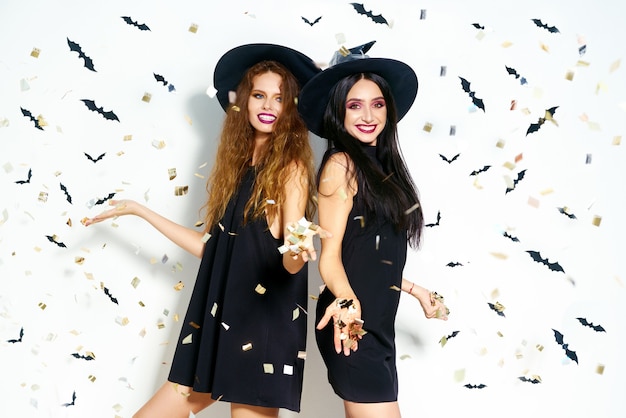 Beautiful women wearing Halloween dresses