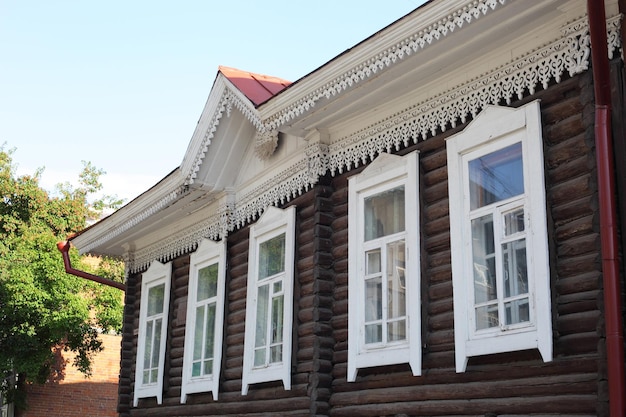 Beautiful wooden house carved platband windows