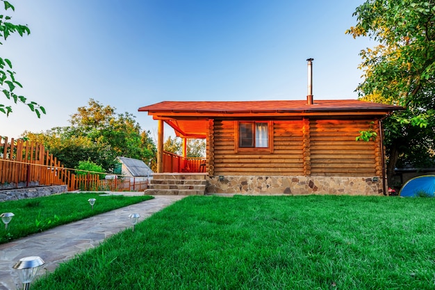 Beautiful wooden house with a lawn.