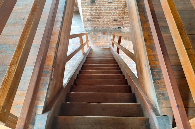 Beautiful wooden staircase in an old building or castle