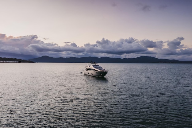 Beautiful yacht at sunset in a bay in brazil high quality photo