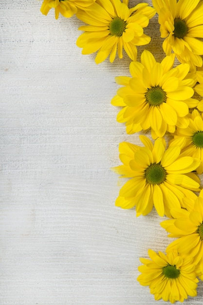 Beautiful yellow flowers on a wooden table