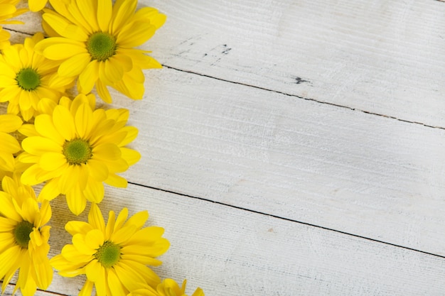 Beautiful yellow flowers on a wooden table