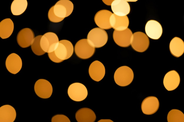 Beautiful yellow round bokeh and black background