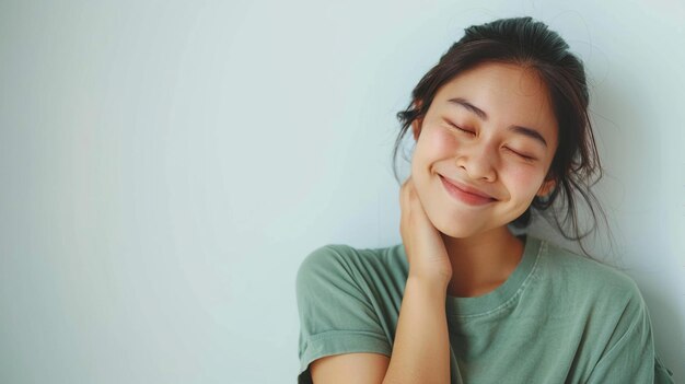 Beautiful young Asian woman smiling and relaxing on white background