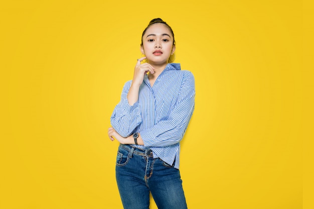 Beautiful young Asian woman wearing a blue shirt