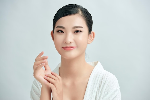 Beautiful Young asian Woman with Clean Fresh Skin look Girl beauty face care