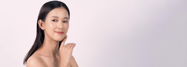 Beautiful young asian woman with clean fresh skin on white background