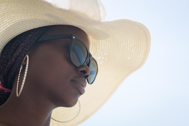 Beautiful young black African American woman on the tropical beach