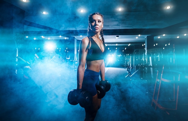 Beautiful young black sportswoman in the gym