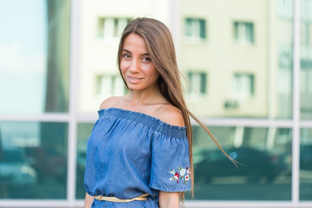 Beautiful young brunette woman looking aside