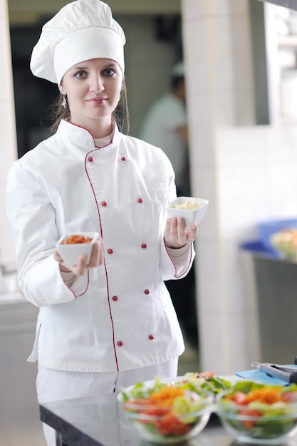 beautiful young chef woman prepare and decorating tasty food in kitchen