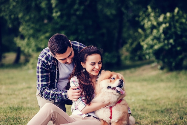 Beautiful young couple and dog