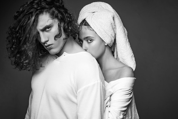 Beautiful young couple Gorgeous woman with a towel on her head posing with handsome brunette man wit