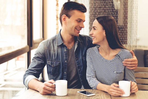 Beautiful young couple is drinking tea.