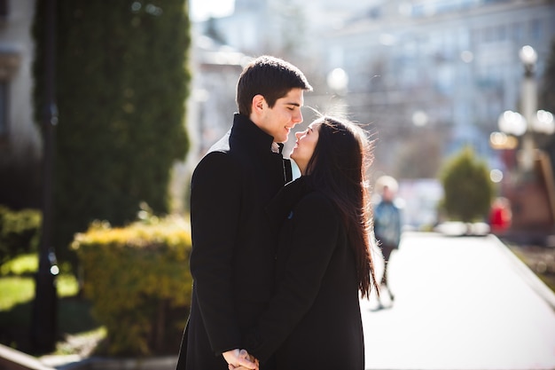 Beautiful young couple meets in a city park