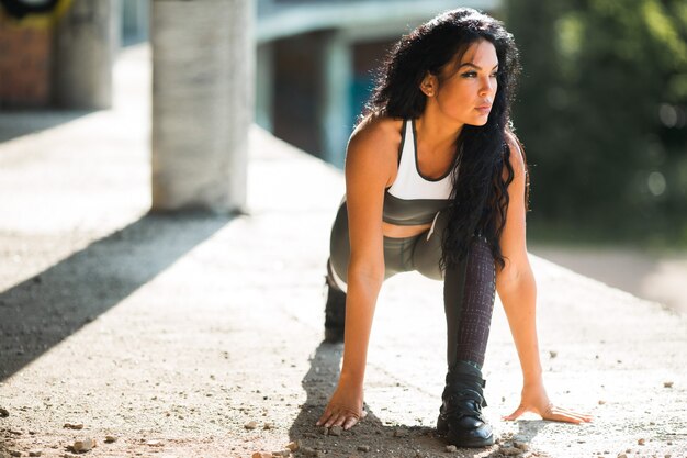 beautiful young female doing sports outdoors in summer