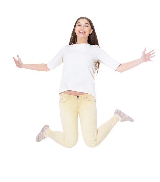 Beautiful young girl jumping on a white background