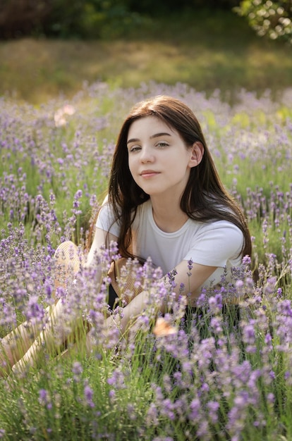 Beautiful young girl on lavender field