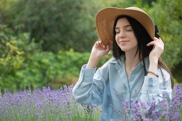 Beautiful young girl on lavender field