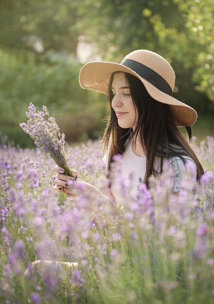 Beautiful young girl on lavender field