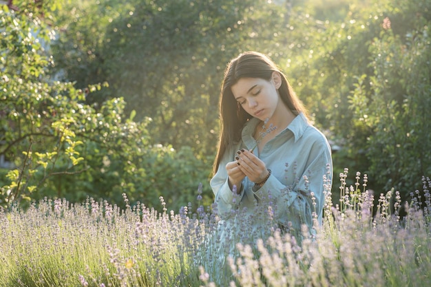 Beautiful young girl on lavender field