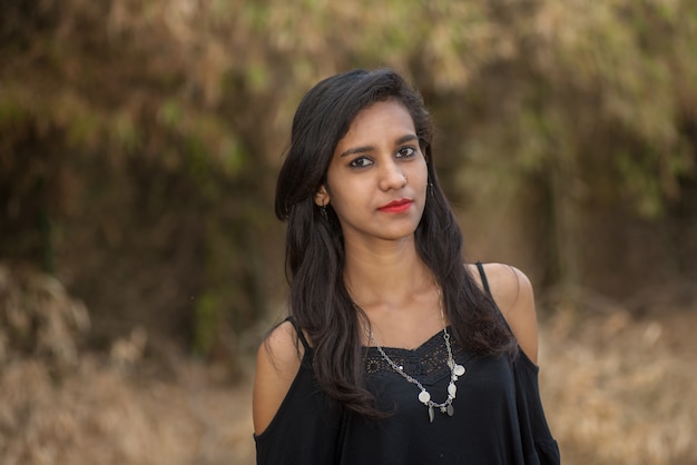 Beautiful young girl posing in a park, Portrait