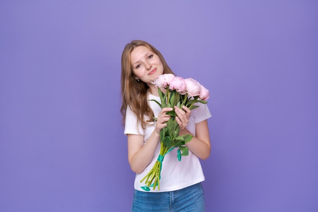 Beautiful young lady with spring flowers celebrating Women39s Day advertising