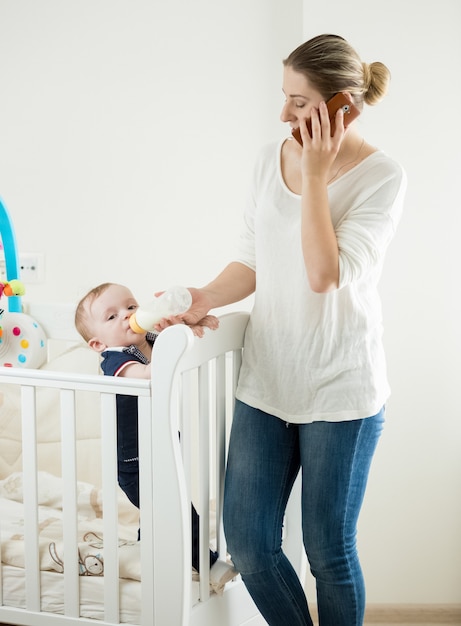 Beautiful young mother is taking care of her toddler