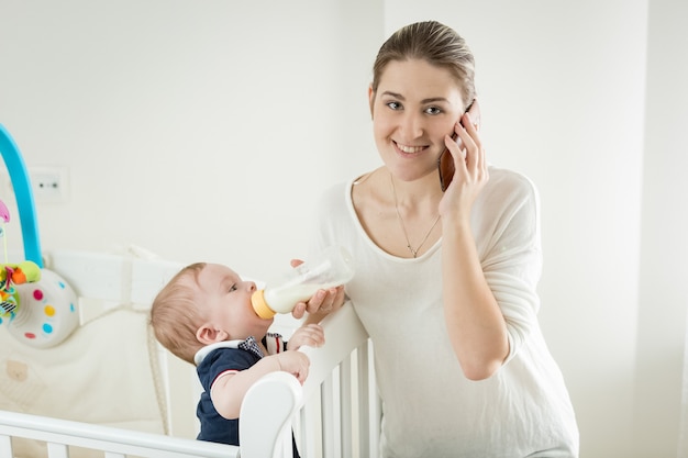 Beautiful young mother is taking care of her toddler