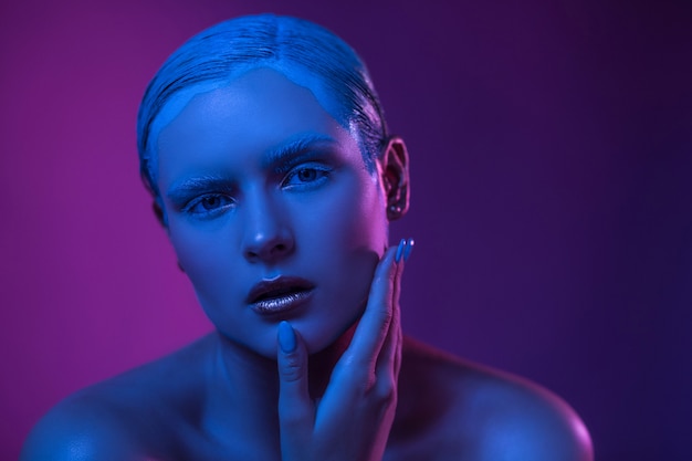 Beautiful Young Sexy Woman in Neon Blue Purple Lights