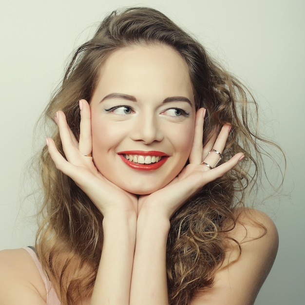 Beautiful young surprised blond woman Studio shot