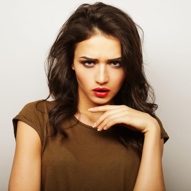 Beautiful young surprised woman Studio shot