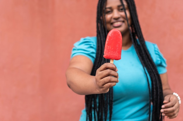 Beautiful Young Traveller Eating Popsicle On The Street