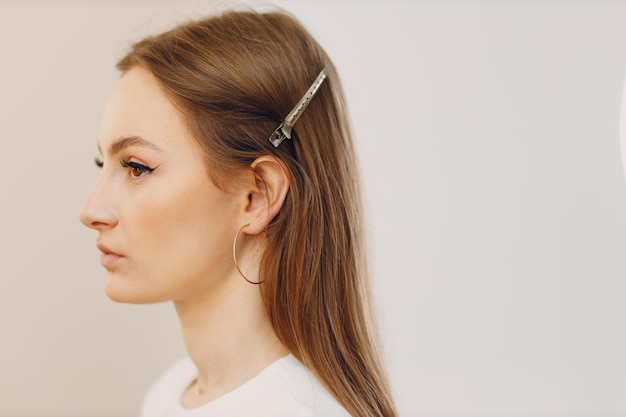 Beautiful young woman applying makeup beauty visage brush