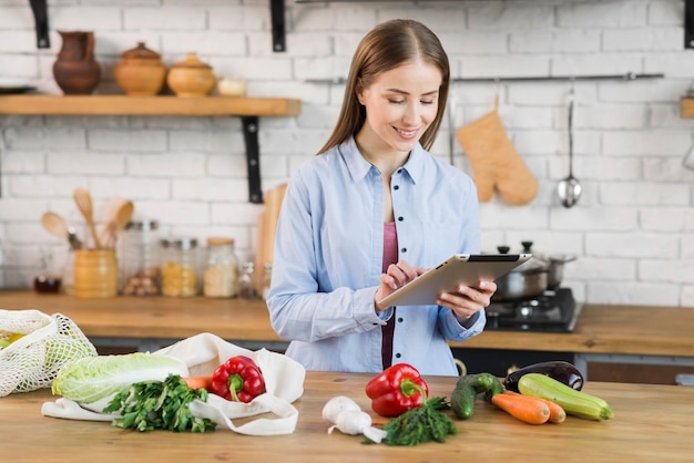 Beautiful young woman checking shopping list